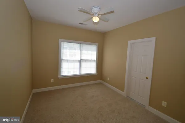 a view of empty room with a window