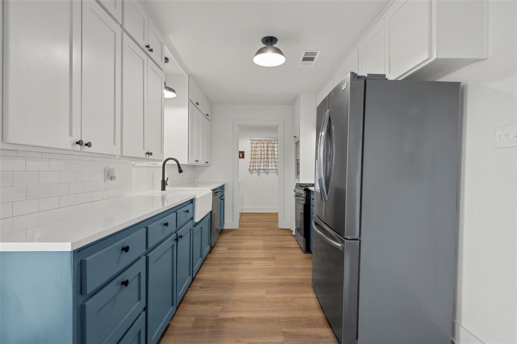 175 4 Corners Road West, TX 76691 - Photo 13 of 30 a kitchen with stainless steel appliances a refrigerator and cabinets