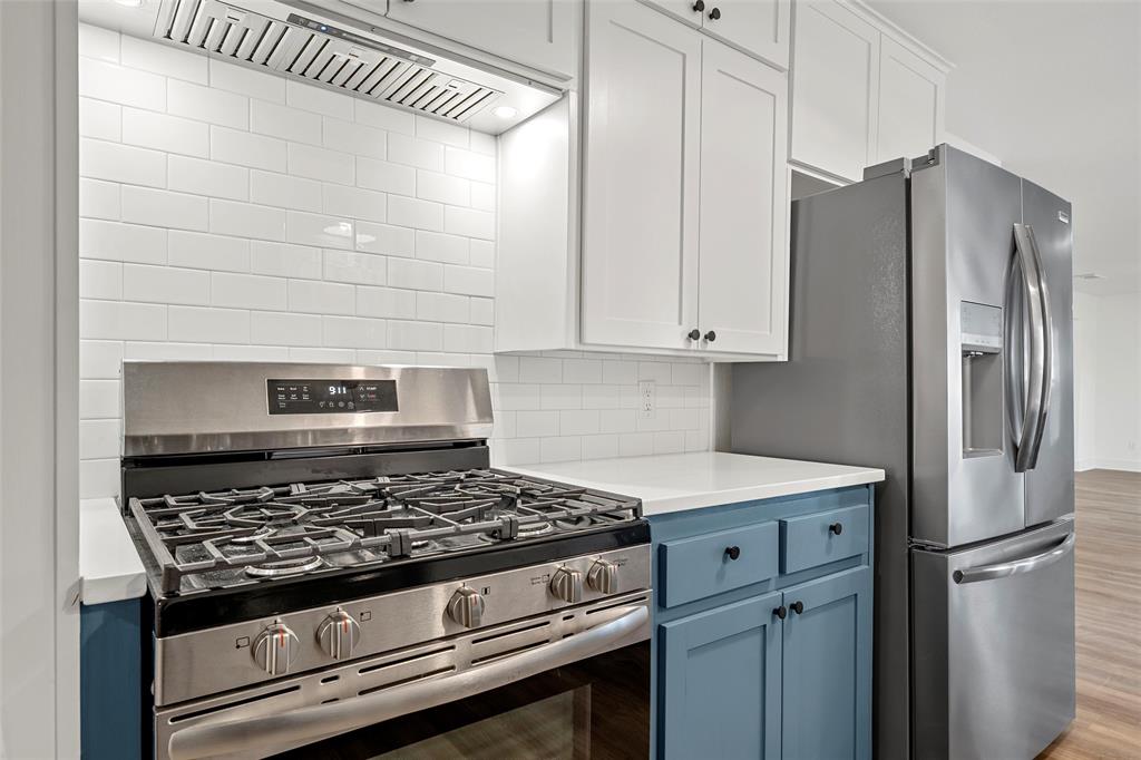175 4 Corners Road West, TX 76691 - Photo 15 of 30 a kitchen with stainless steel appliances granite countertop a stove and a refrigerator