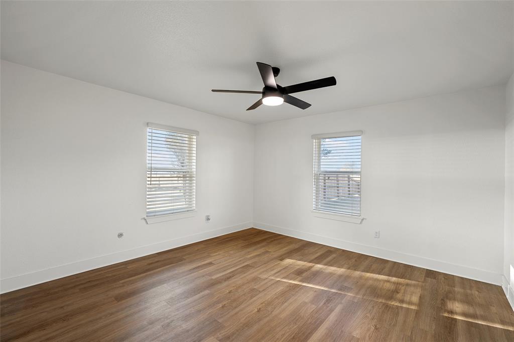 175 4 Corners Road West, TX 76691 - Photo 16 of 30 a view of empty room with wooden floor and fan