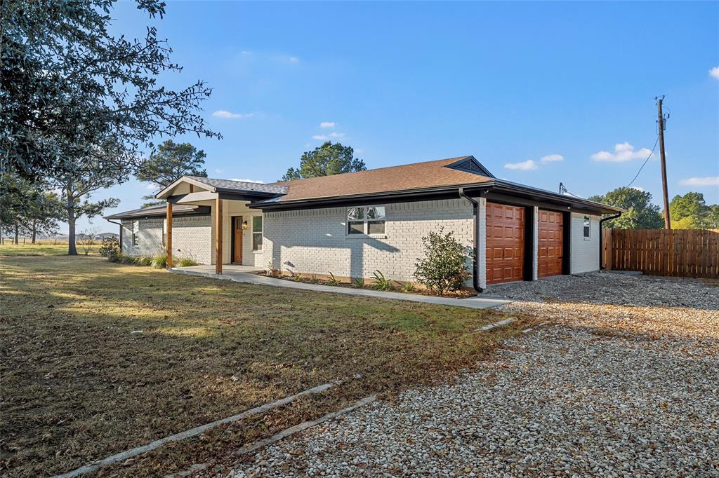 175 4 Corners Road West, TX 76691 - Photo 2 of 30 a front view of a house with garden