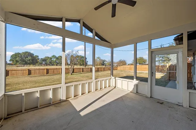 a view of an empty room with a large window