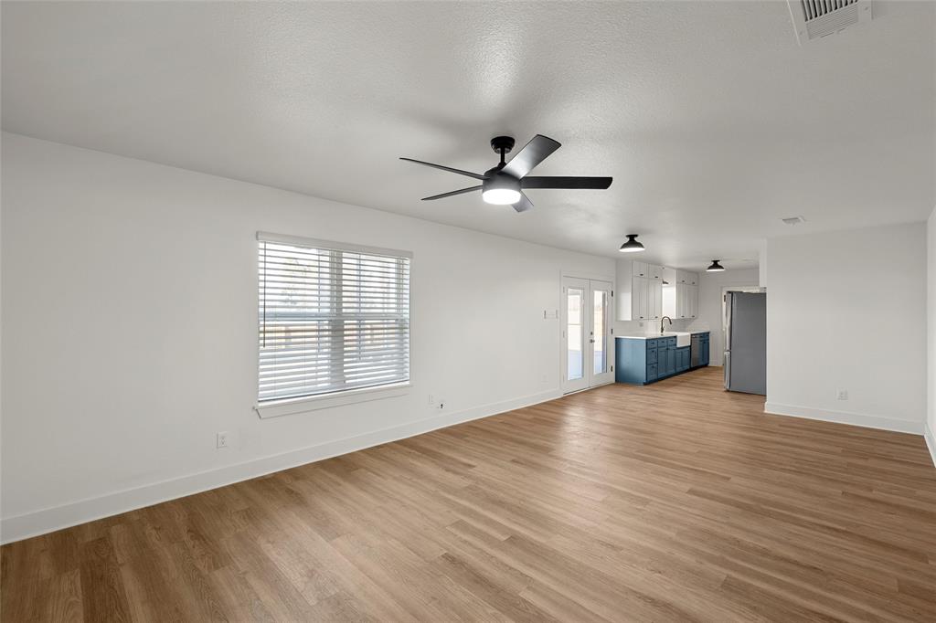 175 4 Corners Road West, TX 76691 - Photo 8 of 30 wooden floor in an empty room with a window