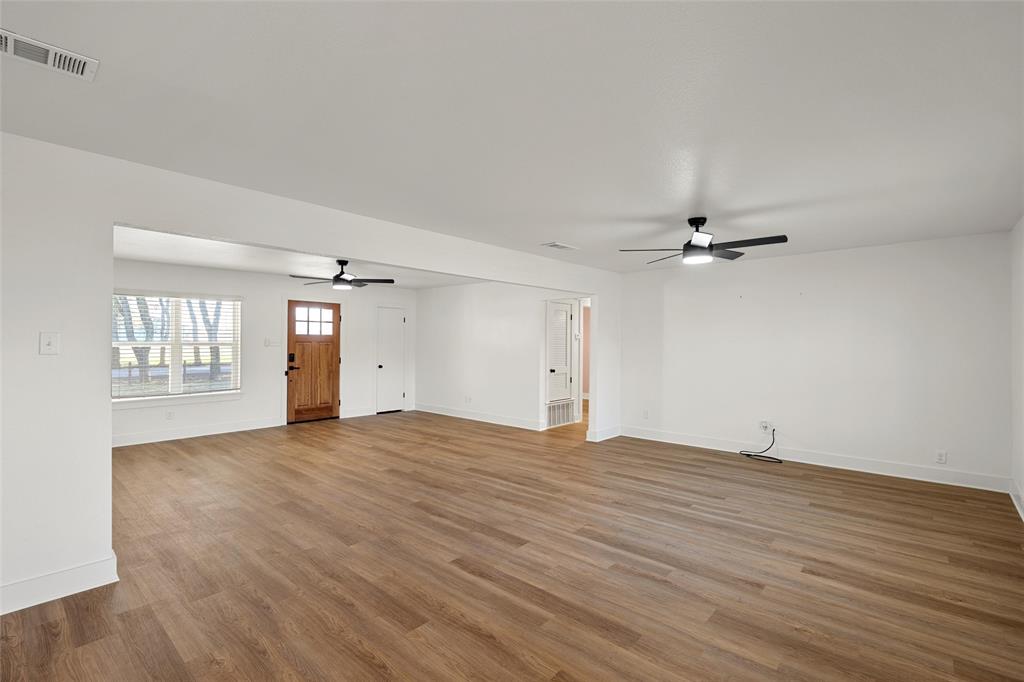 175 4 Corners Road West, TX 76691 - Photo 10 of 30 wooden floor in an empty room with a window