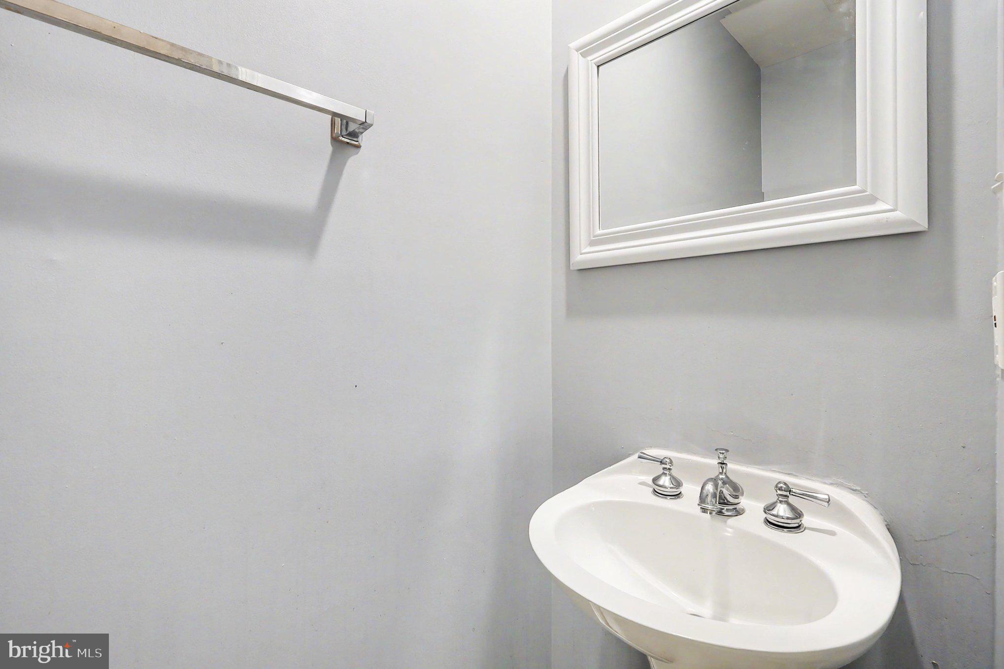 14721 McKnew Road Burtonsville, MD 20866 - Photo 14 of 30 a bathroom with a sink and a mirror