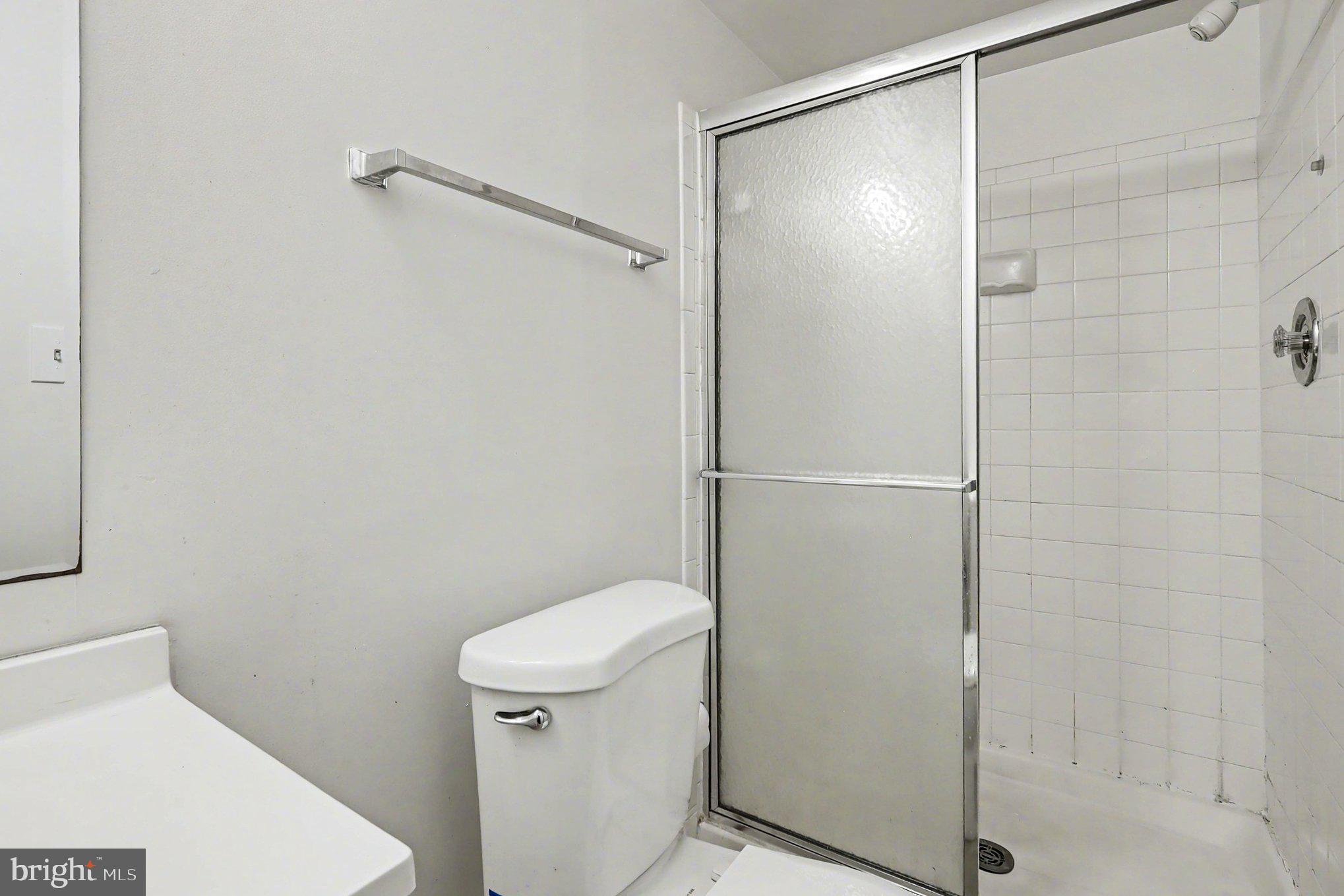 14721 McKnew Road Burtonsville, MD 20866 - Photo 15 of 30 a bathroom with a shower and a toilet