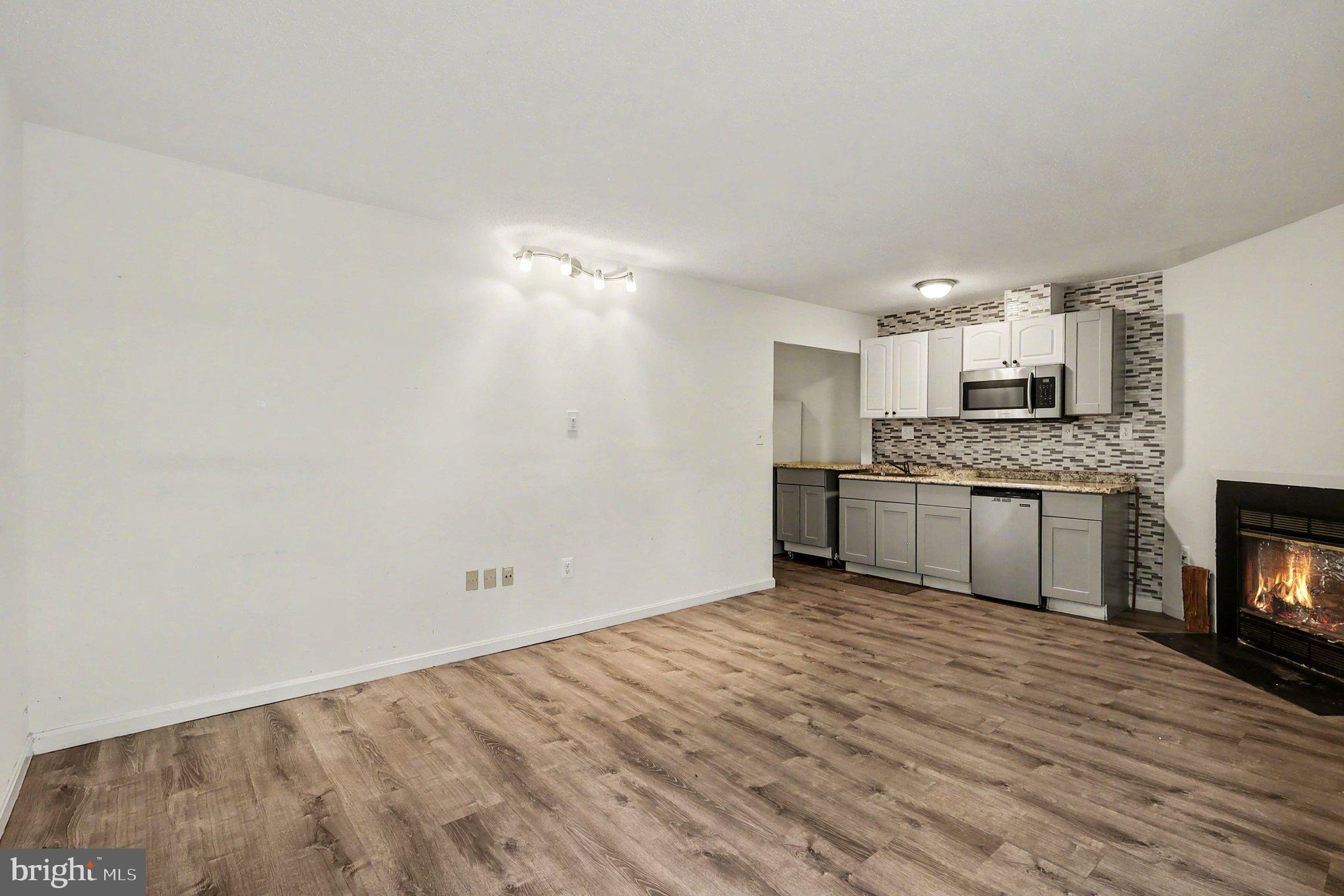 14721 McKnew Road Burtonsville, MD 20866 - Photo 20 of 30 a view of a kitchen with a sink and a stove top oven