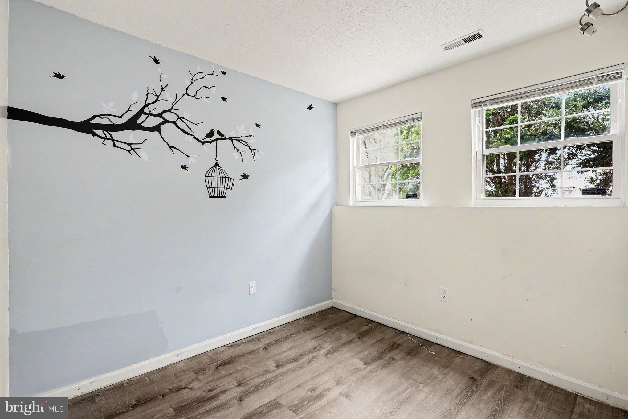14721 McKnew Road Burtonsville, MD 20866 - Photo 23 of 30 a view of a room with window and wooden floor