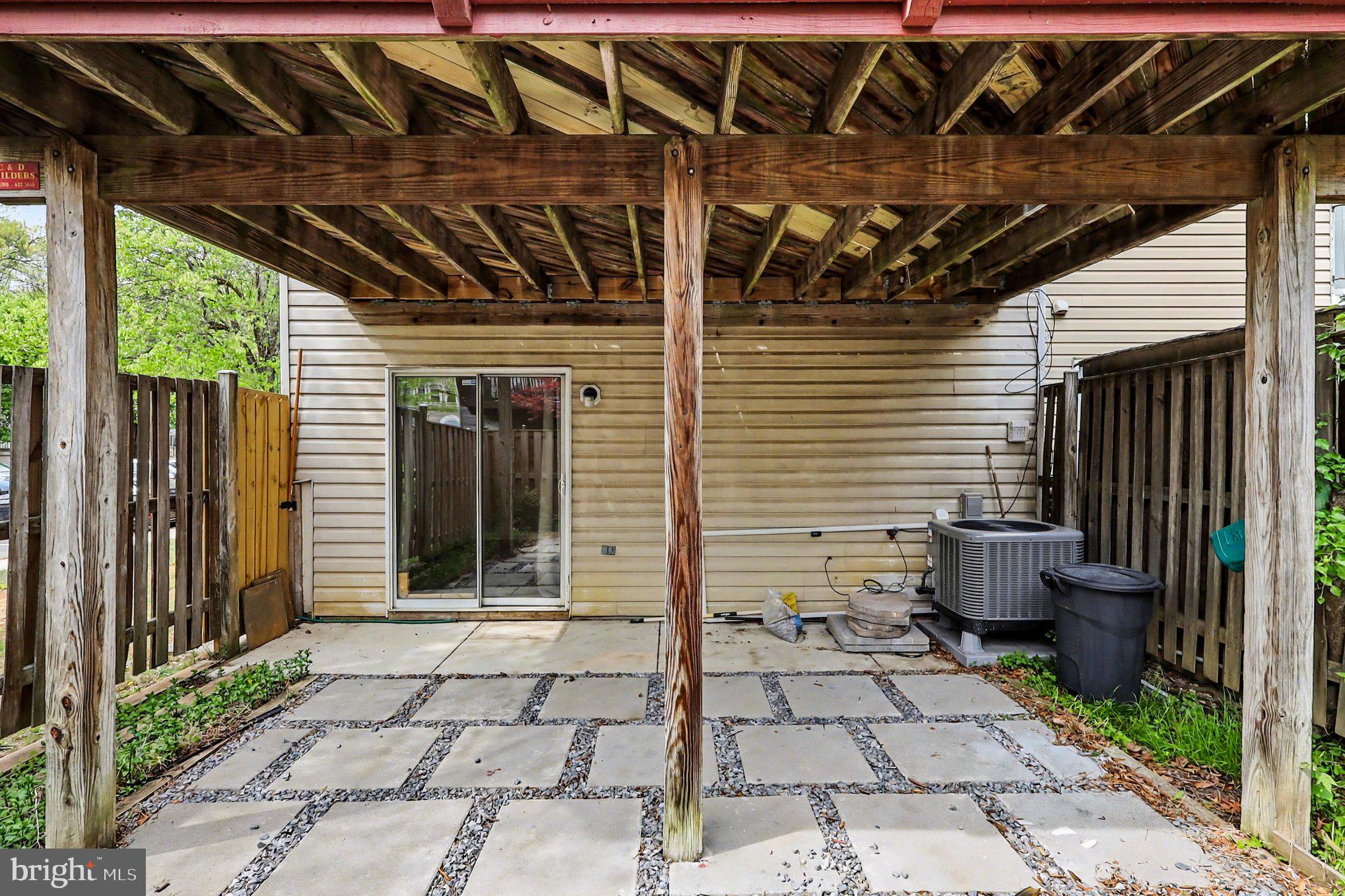 14721 McKnew Road Burtonsville, MD 20866 - Photo 25 of 30 a view of a porch with a door