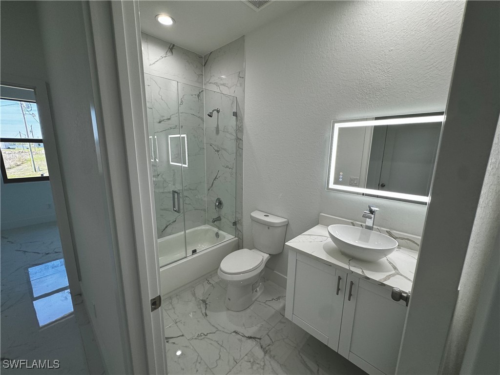 7016 Tide Circle LaBelle, FL 33935 - Photo 31 of 47 a bathroom with a sink a toilet and shower