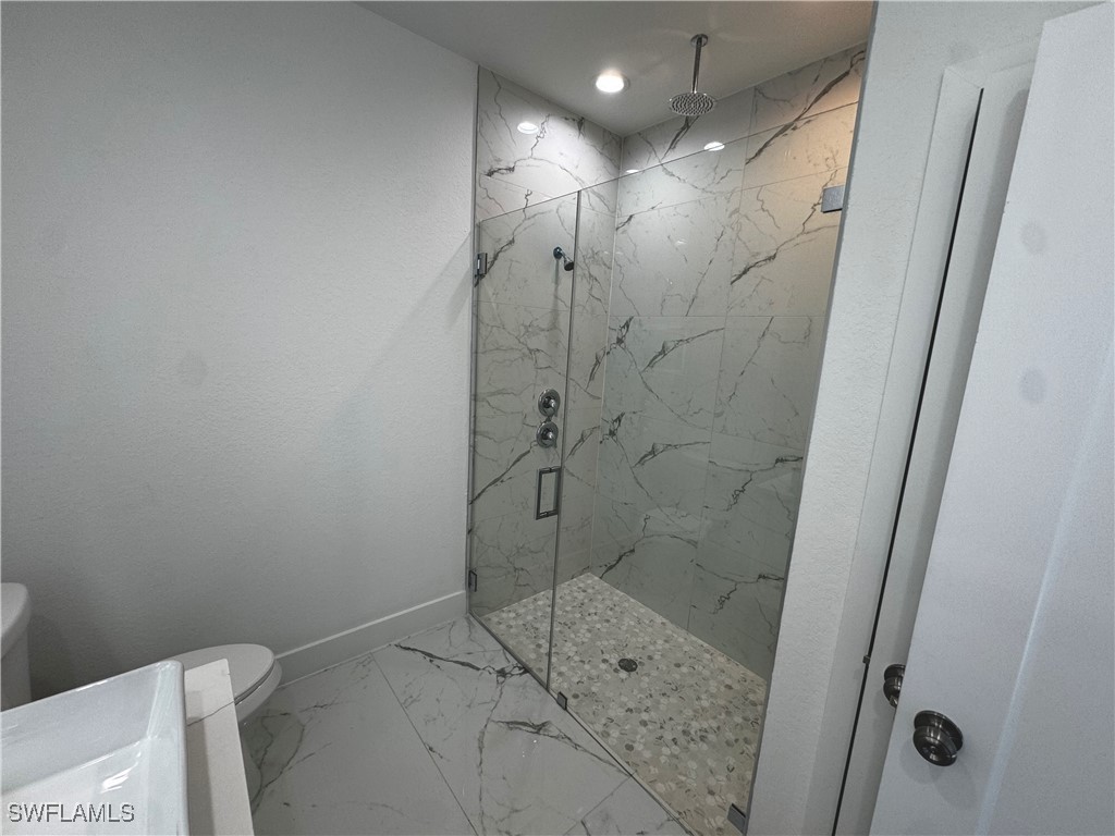 7016 Tide Circle LaBelle, FL 33935 - Photo 34 of 47 a bathroom with a shower and toilet