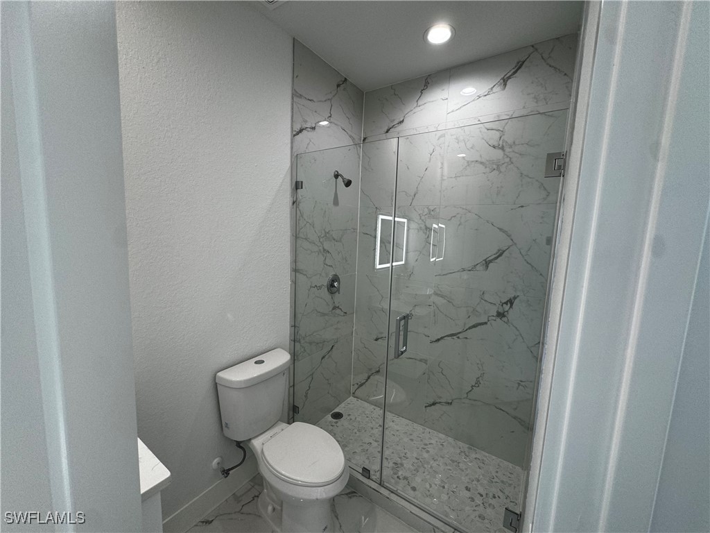 7016 Tide Circle LaBelle, FL 33935 - Photo 36 of 47 a a bathroom with a toilet and a shower