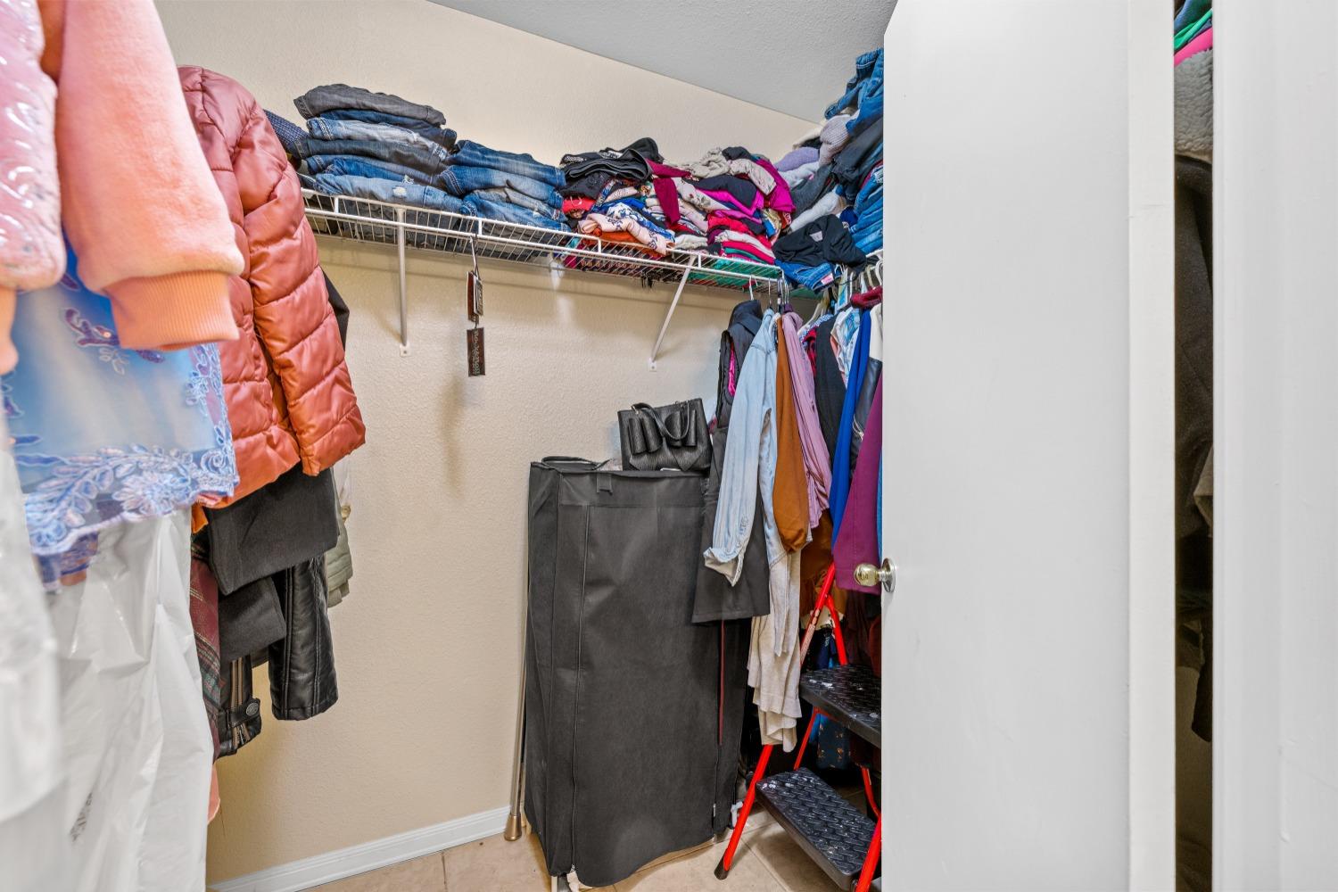 13590 9th Street Parlier, CA 93648 - Photo 18 of 30 a view of a walk in closet