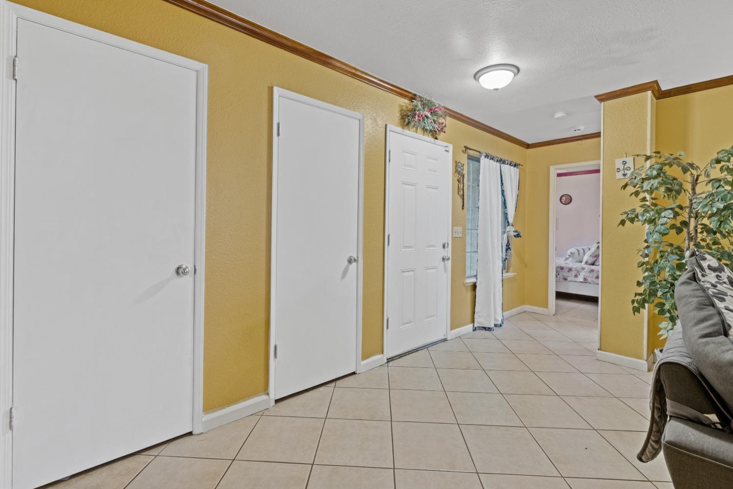 13590 9th Street Parlier, CA 93648 - Photo 19 of 30 a view of a hallway with interior of the house