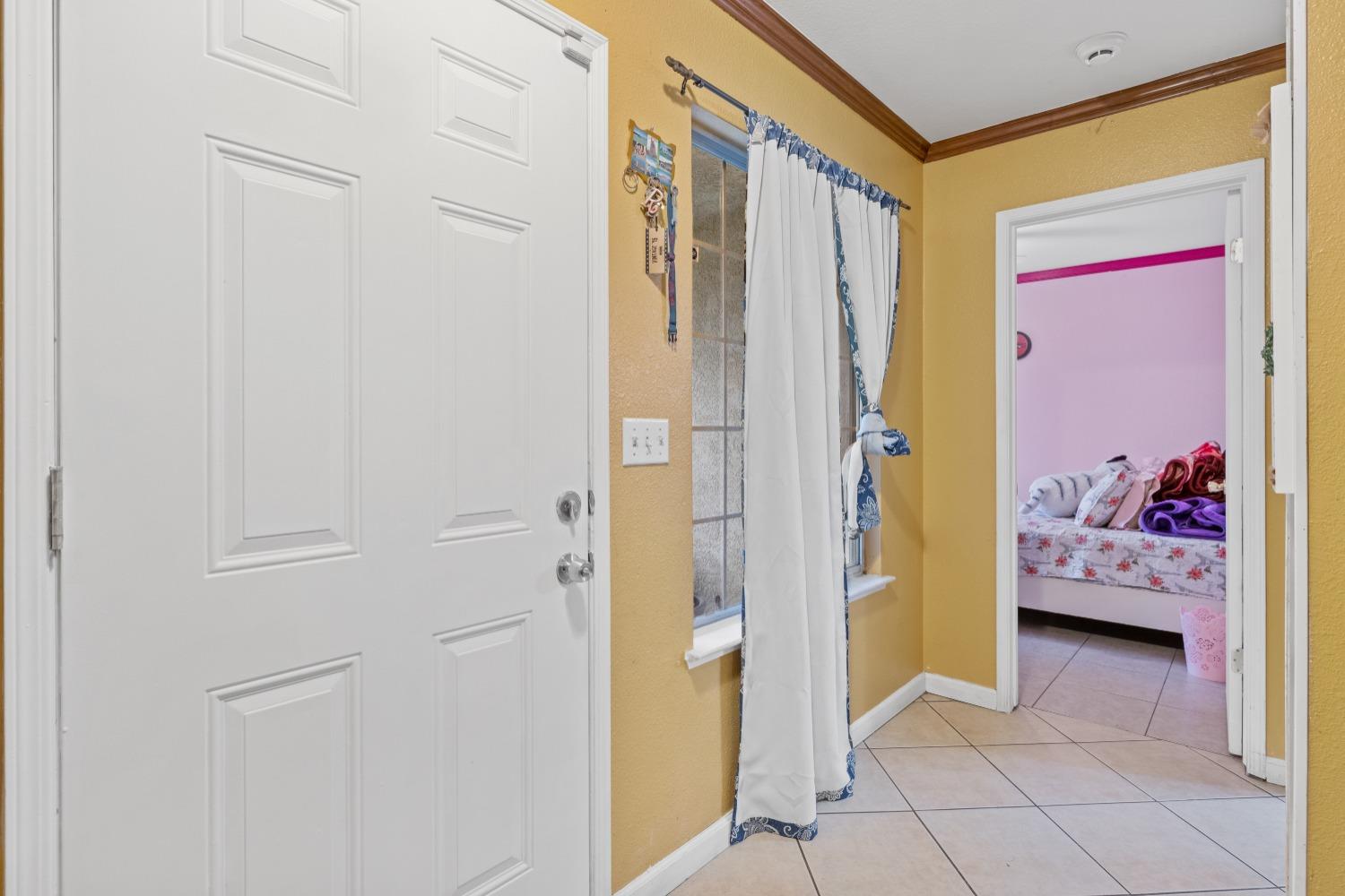 13590 9th Street Parlier, CA 93648 - Photo 20 of 30 a view of a bedroom with a bed and a closet