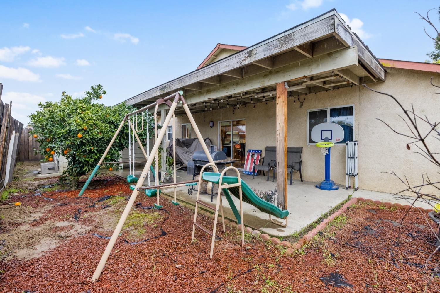 13590 9th Street Parlier, CA 93648 - Photo 28 of 30 a view of a house with a park