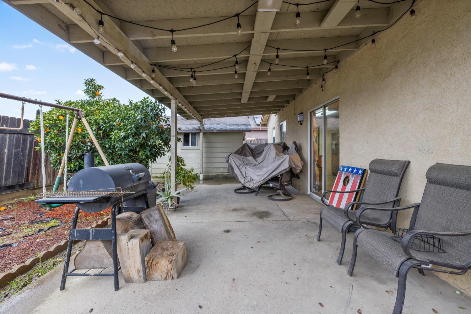 13590 9th Street Parlier, CA 93648 - Photo 29 of 30 a view of a chairs and table in a patio