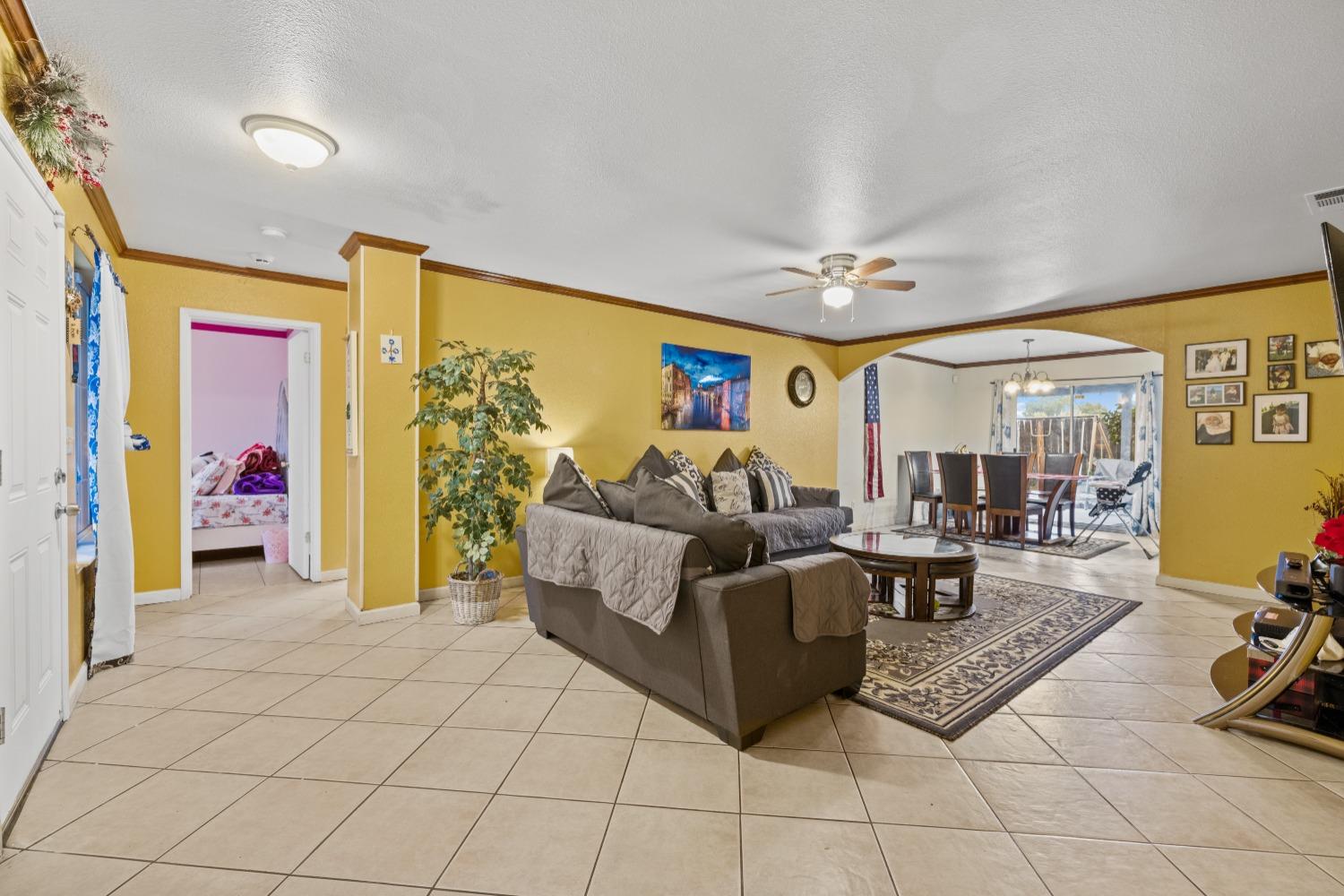 13590 9th Street Parlier, CA 93648 - Photo 5 of 30 a living room with furniture and a large window