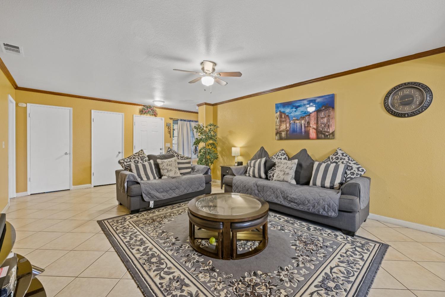 13590 9th Street Parlier, CA 93648 - Photo 7 of 30 a living room with furniture and a large window