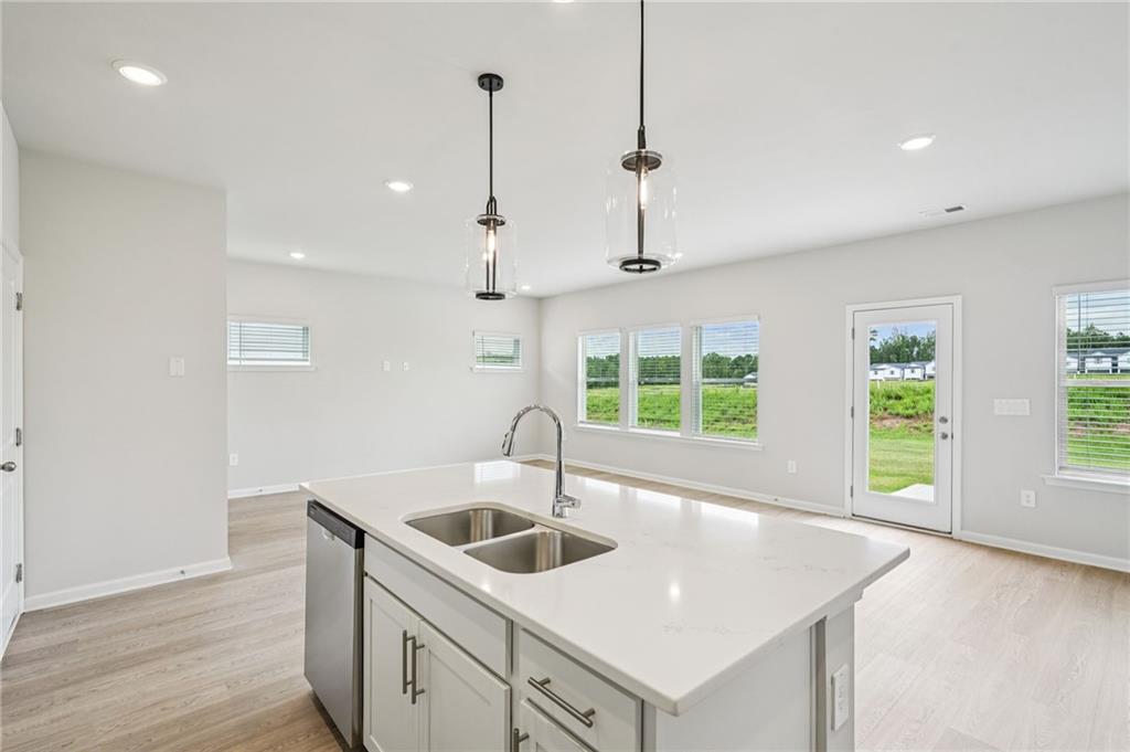 2034 Avalon Ridge Conyers, GA 30013 - Photo 13 of 35 a kitchen that has a sink a window and cabinets
