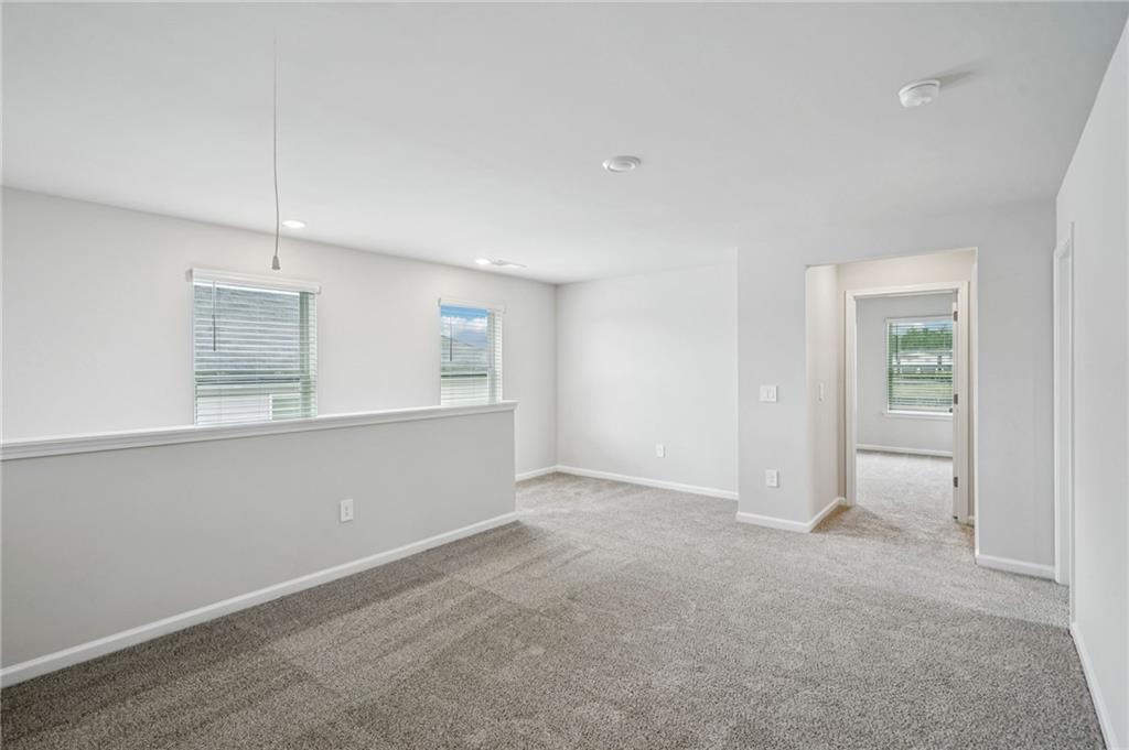 2034 Avalon Ridge Conyers, GA 30013 - Photo 17 of 35 an empty room with windows