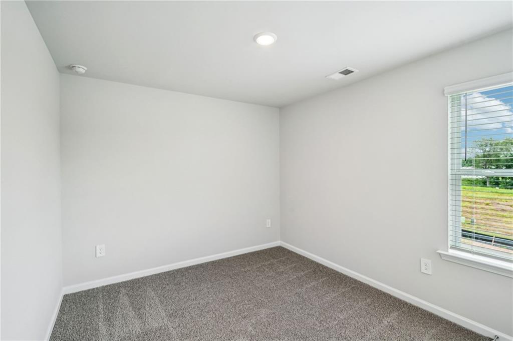 2034 Avalon Ridge Conyers, GA 30013 - Photo 19 of 35 an empty room with a window