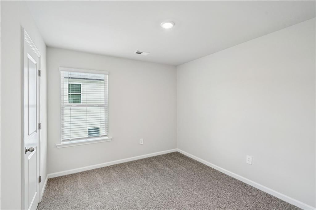 2034 Avalon Ridge Conyers, GA 30013 - Photo 23 of 35 an empty room with a window