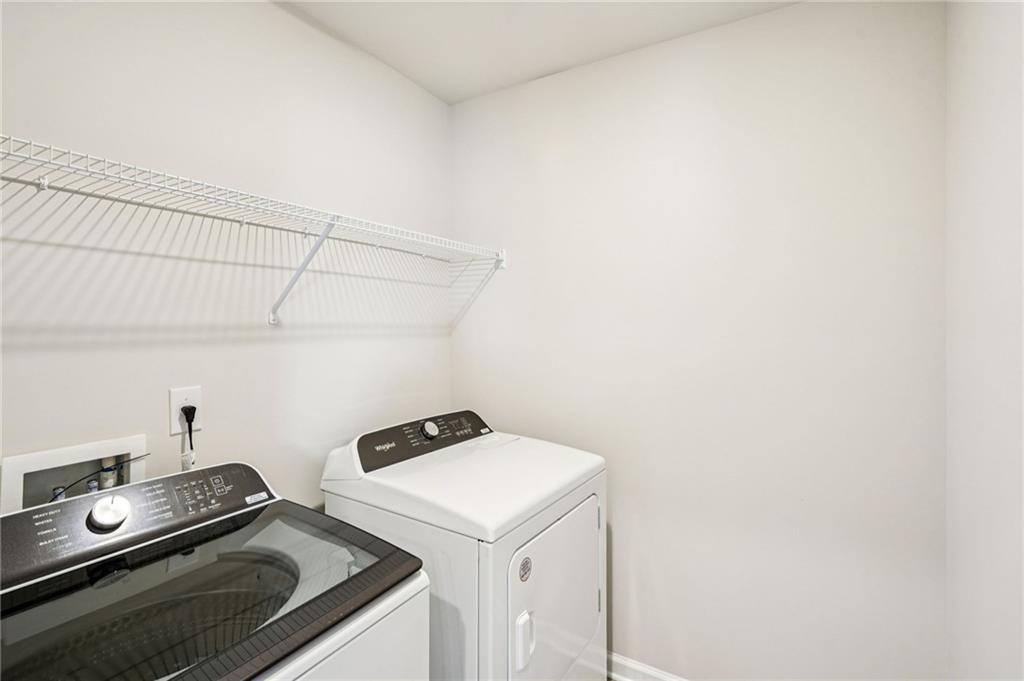 2034 Avalon Ridge Conyers, GA 30013 - Photo 25 of 35 a utility room with dryer and washer