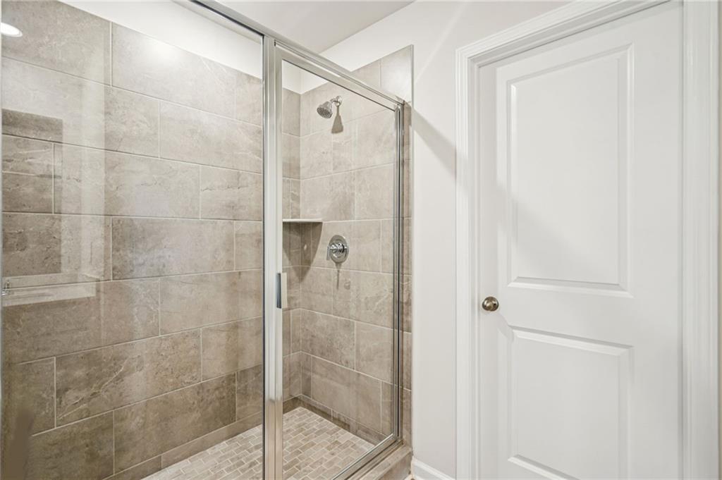 2034 Avalon Ridge Conyers, GA 30013 - Photo 30 of 35 a bathroom with a shower