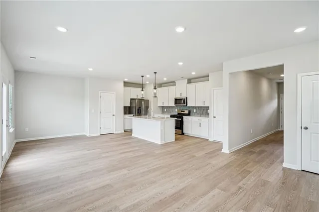 a view of kitchen with wooden floor