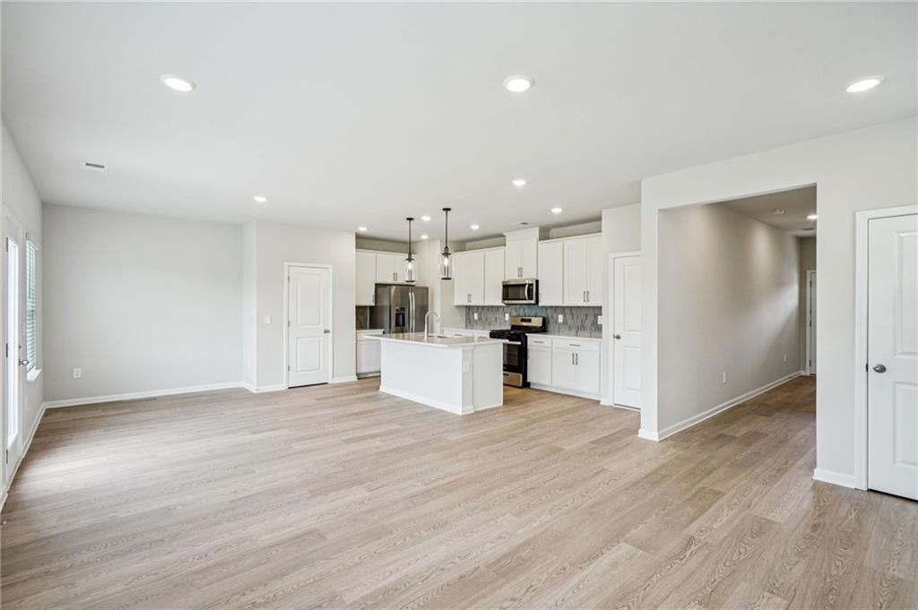 2034 Avalon Ridge Conyers, GA 30013 - Photo 7 of 35 a view of kitchen with wooden floor