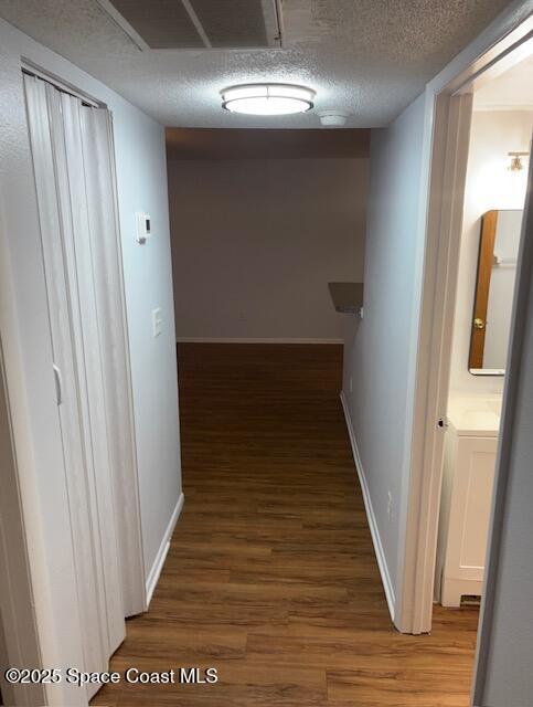 800 North Fiske Boulevard, Unit 114 Cocoa, FL 32922 - Photo 13 of 17 a view of a hallway with wooden floor and staircase