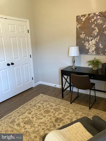 a bedroom with a bed and a table