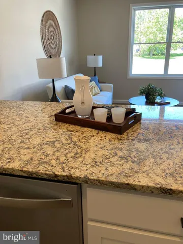 a living room with couch and window