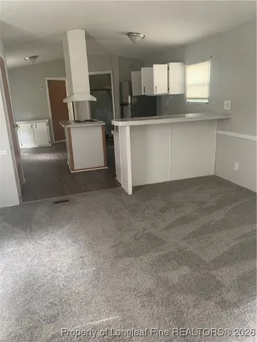 a view of a kitchen with a sink