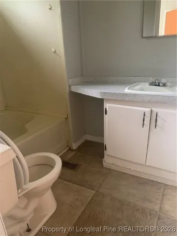a bathroom with a sink and toilet