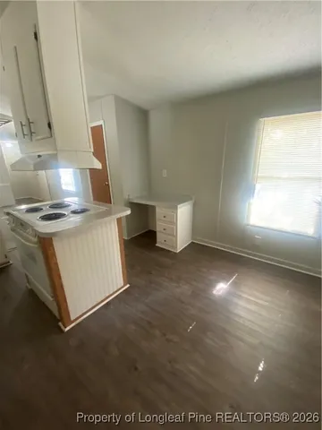 a view of a kitchen with a sink cabinets and a window