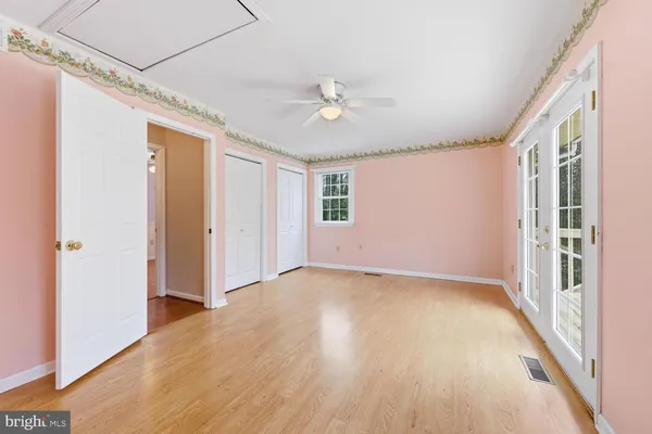 a view of an empty room with a window