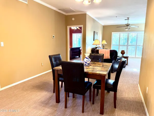 a view of a dining room with furniture window and outside view
