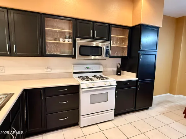 a kitchen with a sink and a microwave