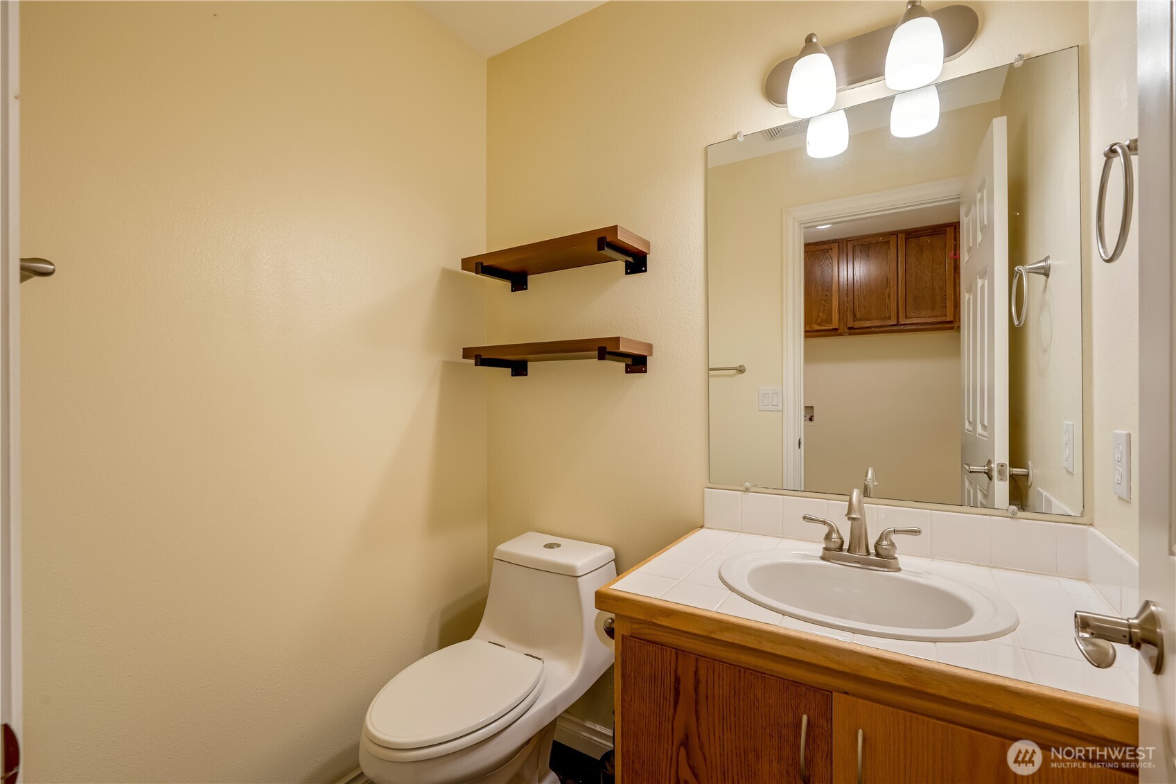 15606 Cascadian Way Bothell, WA 98012 - Photo 14 of 36 a bathroom with a sink a toilet and mirror
