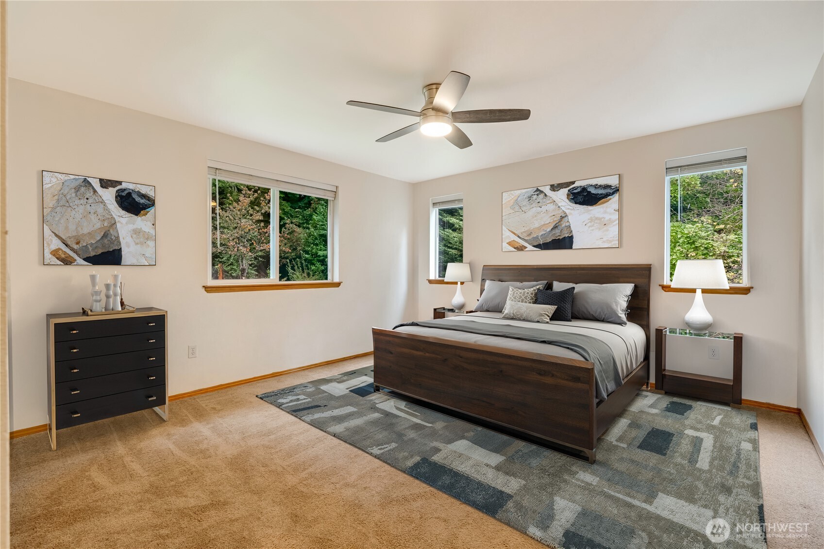 15606 Cascadian Way Bothell, WA 98012 - Photo 16 of 36 a bedroom with a bed and a chandelier