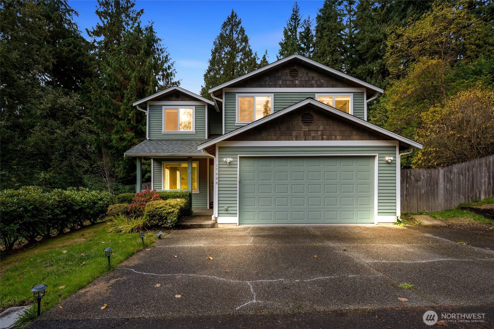 15606 Cascadian Way Bothell, WA 98012 - Photo 2 of 36 a front view of a house with a yard and garage