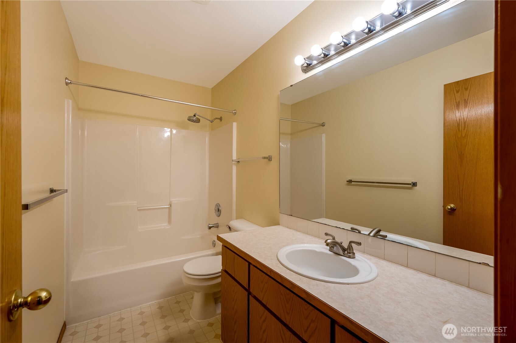 15606 Cascadian Way Bothell, WA 98012 - Photo 21 of 36 a bathroom with a granite countertop sink toilet a large mirror and shower