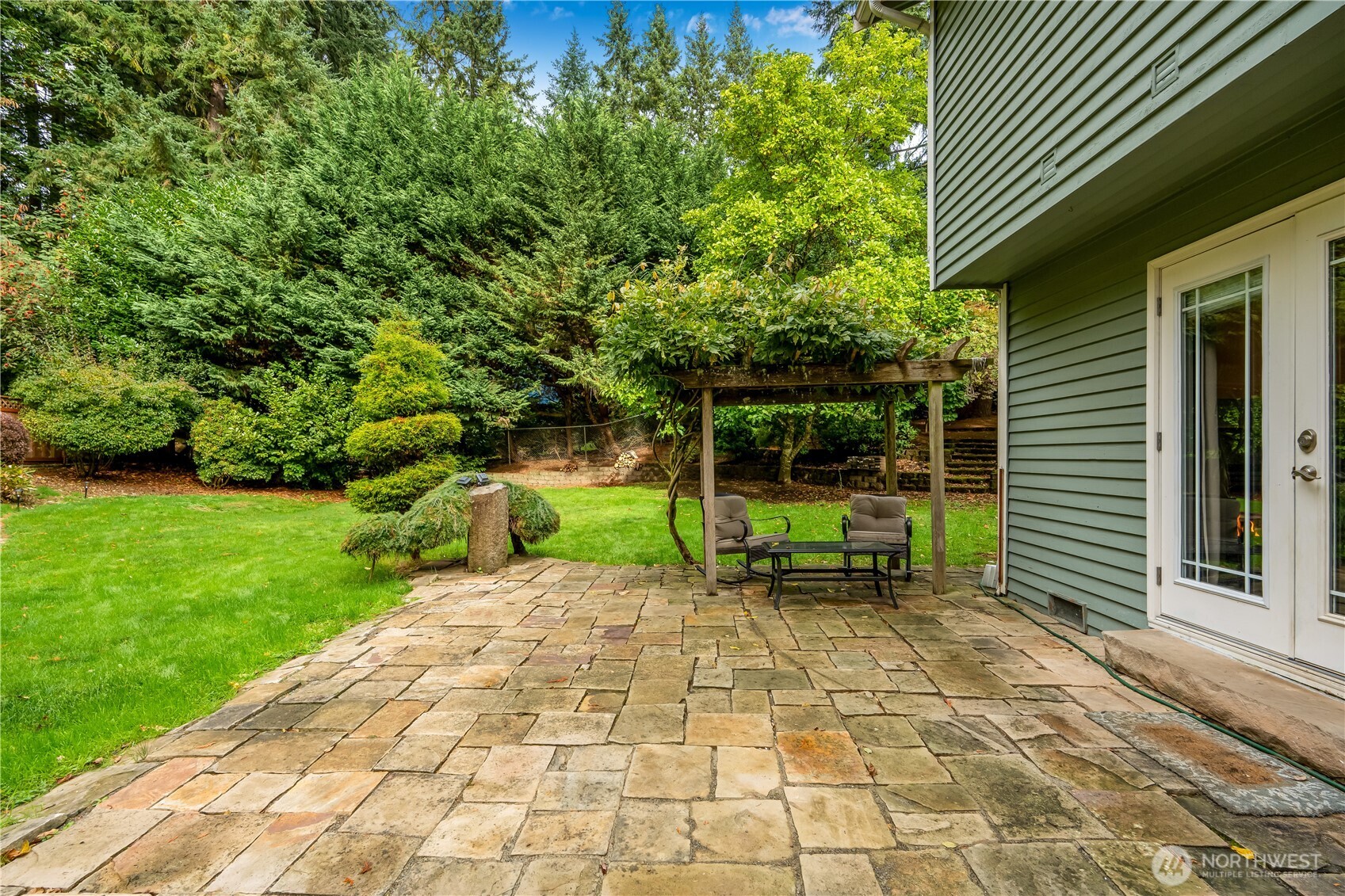 15606 Cascadian Way Bothell, WA 98012 - Photo 25 of 36 a view of a chair and table in backyard of the house