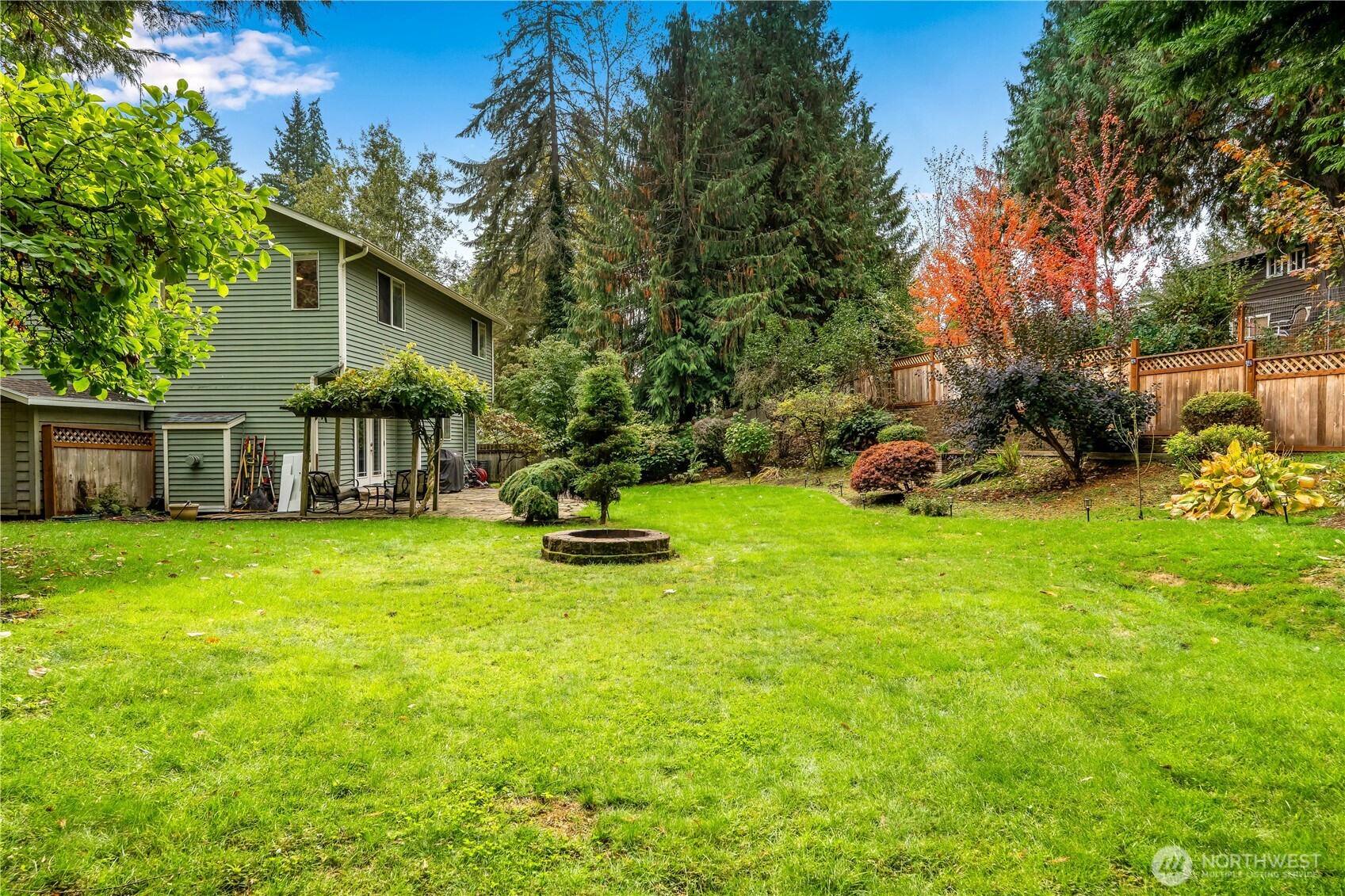 15606 Cascadian Way Bothell, WA 98012 - Photo 28 of 36 a view of a house with backyard porch and garden