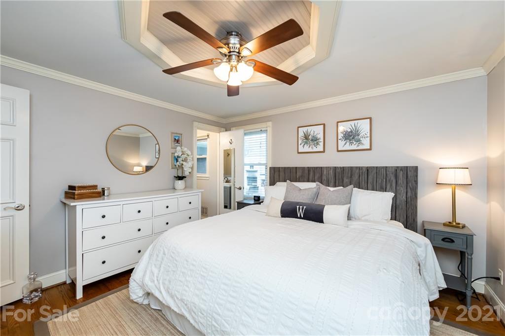 1417 Burnley Road Charlotte, NC 28210 - Photo 22 of 43 a bedroom with a bed and a dresser