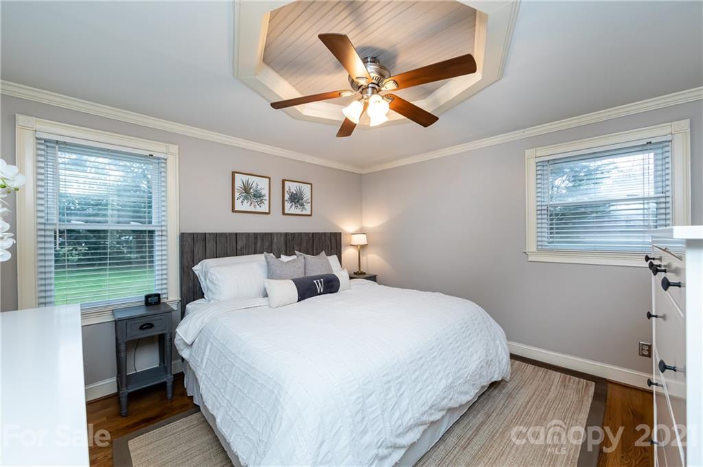 1417 Burnley Road Charlotte, NC 28210 - Photo 23 of 43 a bedroom with a bed and a window