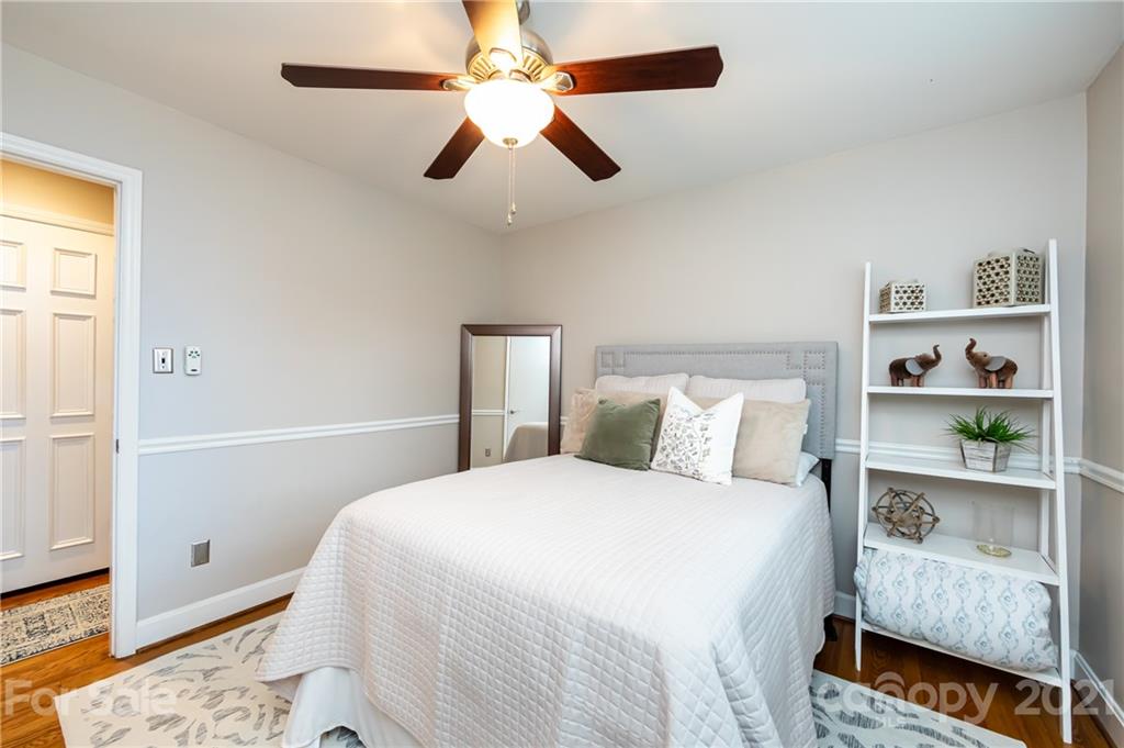 1417 Burnley Road Charlotte, NC 28210 - Photo 27 of 43 a bedroom with a bed and a window