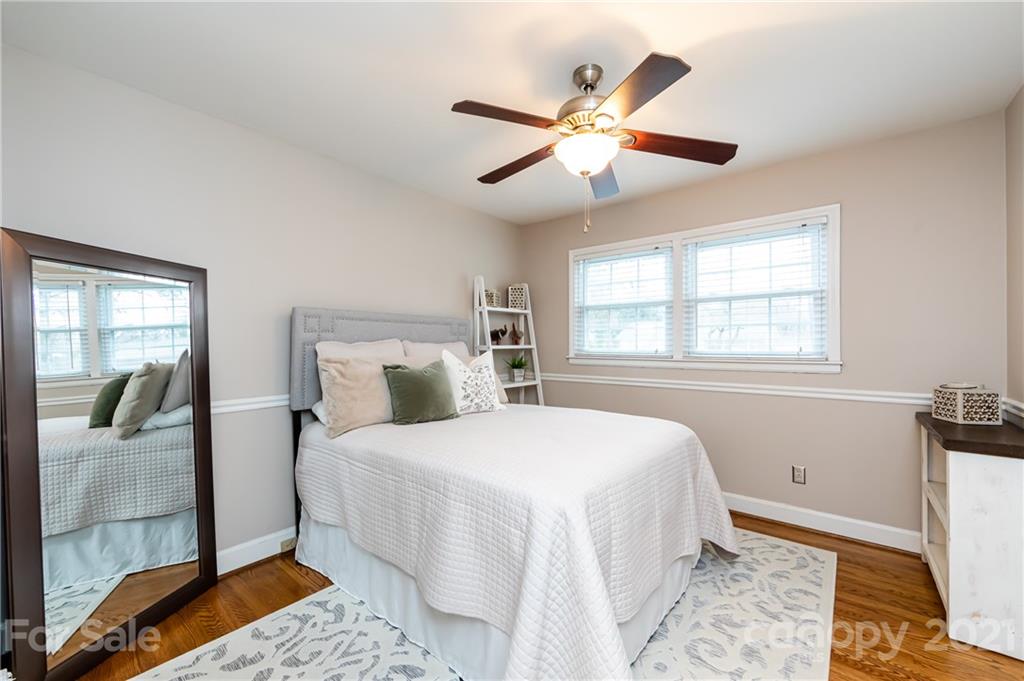 1417 Burnley Road Charlotte, NC 28210 - Photo 28 of 43 a bedroom with a bed and a window